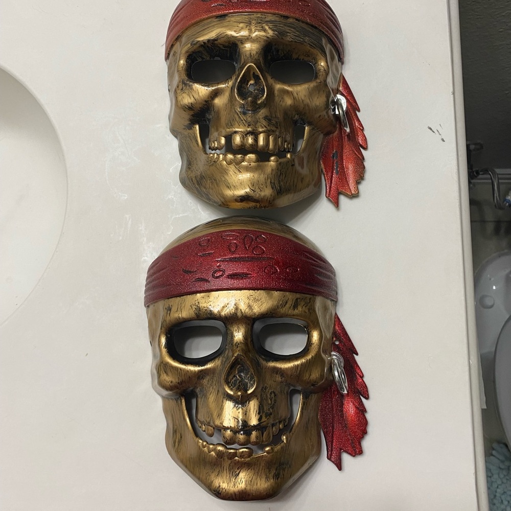 Gold pirate skull masks x2